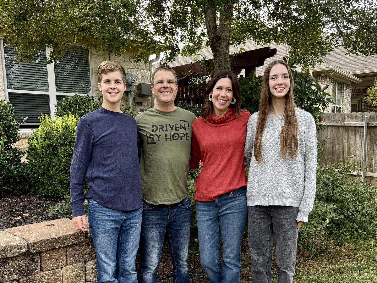 Blake and Julie with their twins outside their home